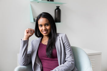 woman sitting in chair smiling